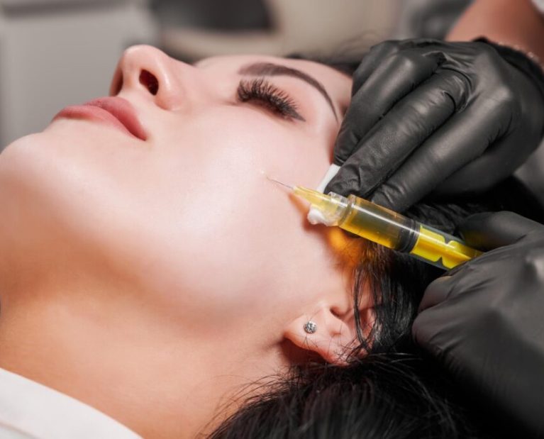 female-doctor-making-injection-woman-chin_651396-3385-1024x681
